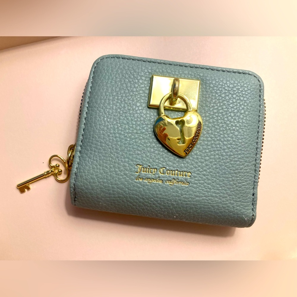 Juicy Couture wallet. Gray / Blue never used. Clean and in wonderful condition.